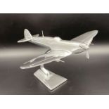 A CAST ALUMINIUM MODEL OF A SPITFIRE FIGHTER PLANE,
