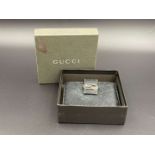 GUCCI, &nbsp;a black, grained, leather wallet with signed and polished clasp