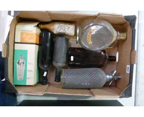 A mixed collection of vintage beer bottles to include large dimple whiskey decanter, mesh covered soda syphon, early David Br