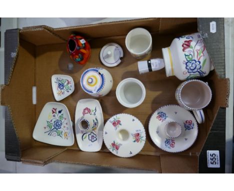 A collection of Poole Pottery hand decorated items to include large lamp base, posy bowl, egg cup, jam pots and vases etc