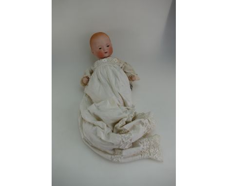 Armand Marseille early 20th century bisque headed baby doll with closed mouth and moving eyes in lace costume, marked AM Germ