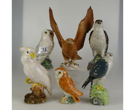 A collection of Beswick animals to include Golden Eagle 2062 (damaged), Barn Owl 2026, Osprey decanter 2583 and Doulton Snowy