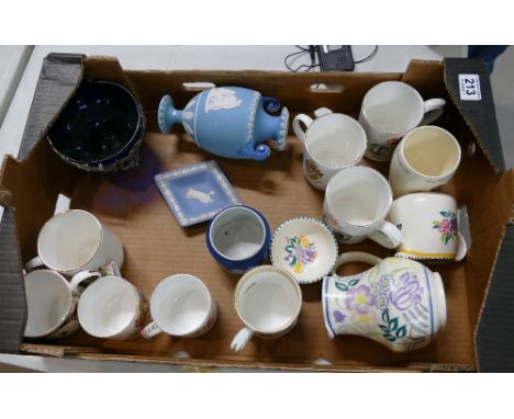 A mixed collection of items to include hand painted Poole pottery jugs, commemorative cups, damaged Wedgwood items etc 