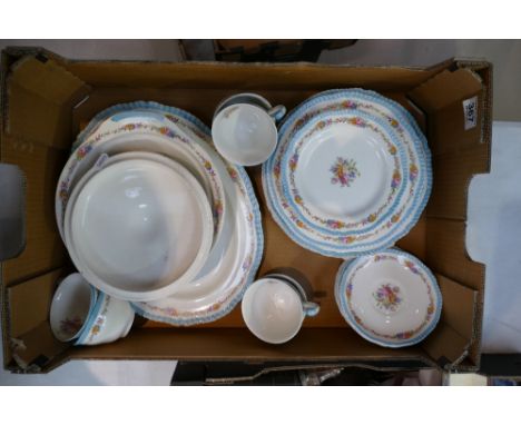 A collection of Woods ivory floral decorated dinnerware to include dinner plates, serving platters, cups, saucers etc 