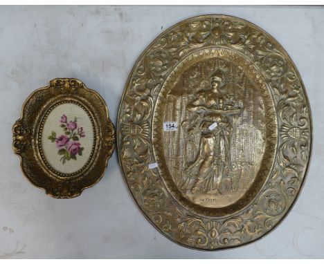 Large continental brass embossed wall plaque titled L.A Festin together with more modern framed tapestry piece (2)