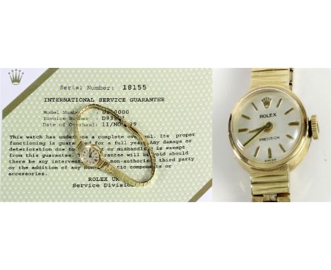 Rolex: A ladies 9ct gold manual wind bracelet watch
The cream dial with applied hourly batons, the circular case to tapering 