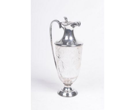 An Edward VII silver mounted and cut glass claret jug
Raised on a silver domed foot, the ovoid form body with hobnail and sta