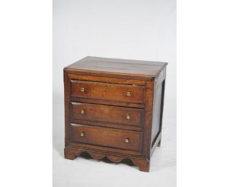 An early 18th Century oak chest of drawers
The rectangular moulded three plank top above a plain frieze and three moulded lon