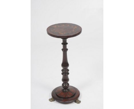 An early 19th Century inlaid mahogany and marquetry lamp stand
With a 29.5cm diameter top inlaid with a roundel enclosing a e