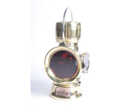 An early brass Lucas "King of the Road" rear oil lamp
With a shaped copper applied manufacturers label stamped Lucas No. 636 