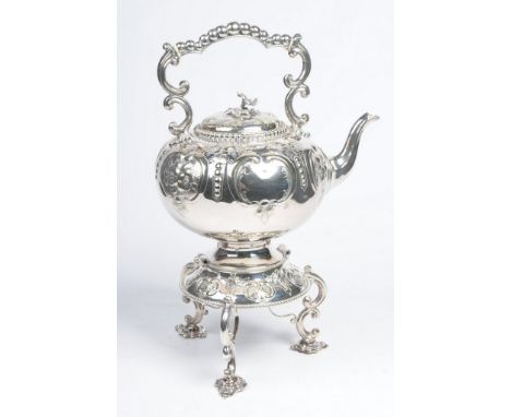 A Victorian silver-plated spirit kettle
Of rounded globular form, with scroll and bead work handle, raised on a tapered plint