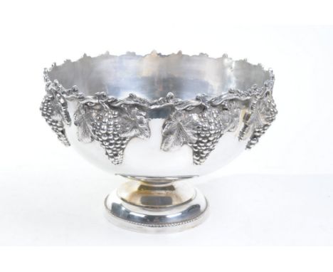 A silver-plated punch bowl
Of pedestal form rising from a stepped circular spreading base, the exterior sides cast with fruit