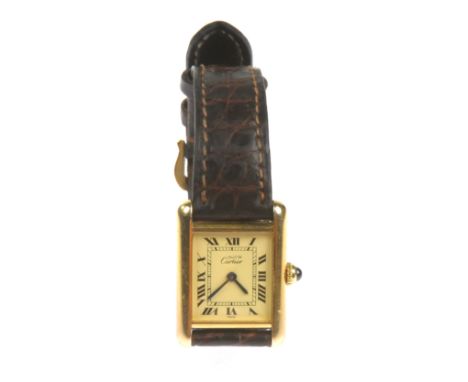 A Must de Cartier .925 silver gilt cased 'Tank' wristwatch
The Art Deco design case set with a blue cabochon winder, the vers