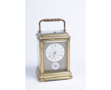 A gilt brass striking carriage clock
With a 5.5cm white enamel Roman and Arabic dial with blued moon hands and alarm ring bel