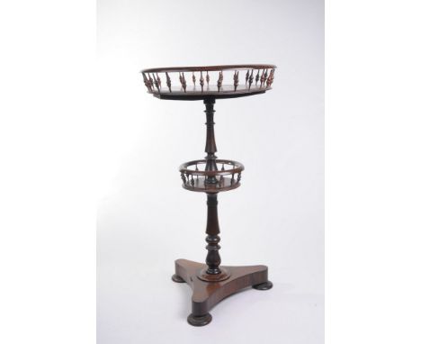 A choice George IV rosewood centre table
The 42cm moulded top above a slender spindle gallery raised upon a vase shape balust