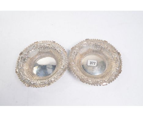A pair of Victorian silver pierced bon bon dishes
Each of circular form with scalloped rim, the pierced and half fluted sides