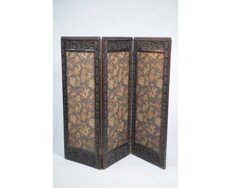 A carved oak three fold draft screen Art Nouveau design
Each rectangular panel with a sunflower, leaf and flower carved panel