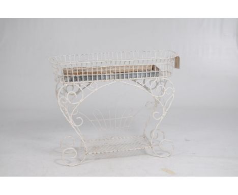 A wirework and painted conservatory planter late 19th / 20th Century
Of scrollwork design and rounded end rectangular form ra