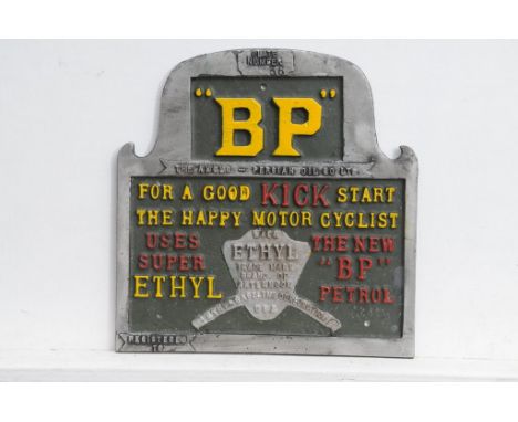 A painted "BP" motor oil sign
The sign cast with text, "BP for a good kick start, the happy motor cyclist user Super Ethyl, t