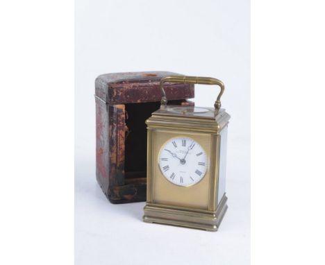 A gilt brass striking carriage clock
With a white 5.5cm enamel dial signed Payne & Co., 163 New Bond Street, London with blue