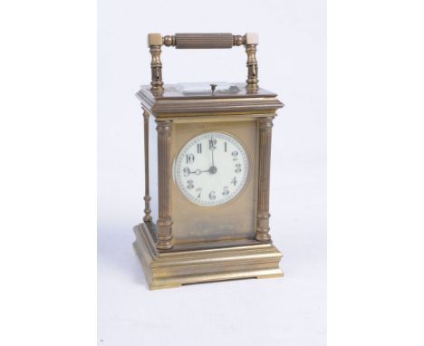 A gilt brass French carriage clock
With a 6cm white enamel Arabic dial with blued moon hands, platform lever escapement, stri