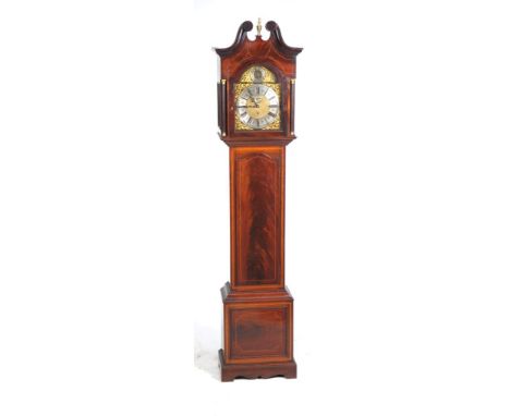 An Edwardian inlaid mahogany longcase clock
With a 30cm arched brass dial with Arabic and Roman numerals, subsidiary seconds 