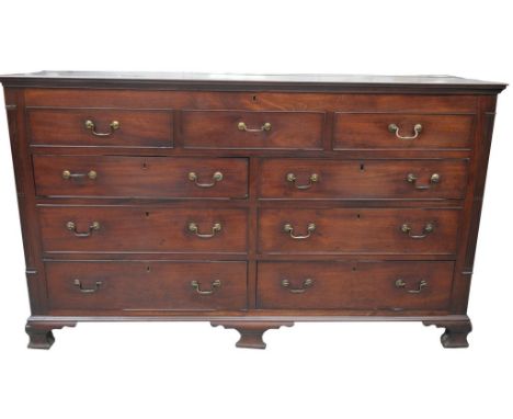 An early 19th Century mahogany mule chest
The rectangular hinged top with a vacant interior above three faux drawers six grad
