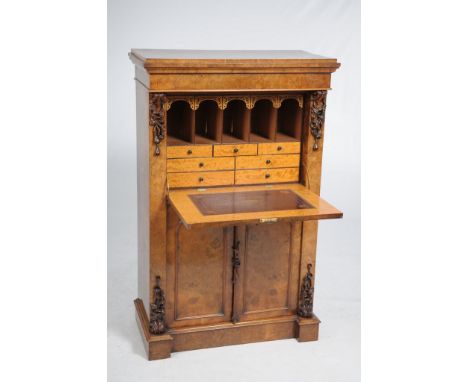 A fine early Victorian burr walnut secrétaire à abattant 
The rectangular well figured top raised on a plinth above a frieze 