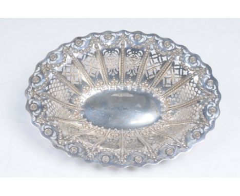 An Edward VII silver pierced fruit or pastry basket
Of scalloped oval form, the sides pierced with segmented scroll and folia