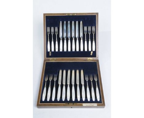 A cased set of George V silver and mother of pearl fruit or pastry knives and forks
Comprising twenty-four pieces each with m