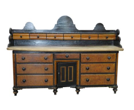 A Victorian pine and painted sycamore dresser
The shaped arched triple back above a frieze of six shaped drawers, the rectang