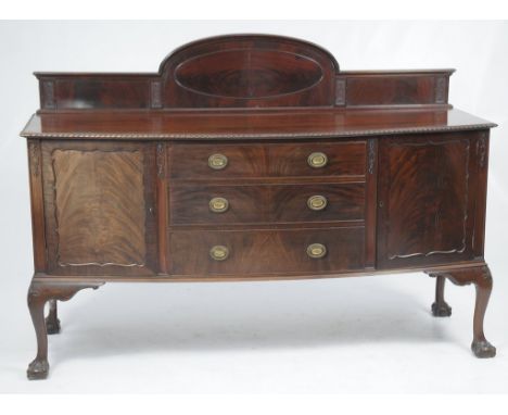 A early 20th Century mahogany bowfront sideboard
The raised back centred with an oval, the lower part with a gadrooned frieze