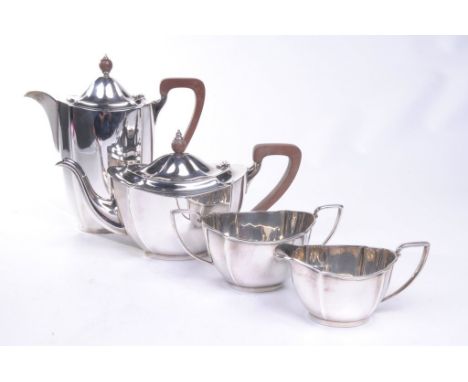 A George V four piece silver tea and coffee service
Comprising coffee pot, tea pot, milk jug and turn handled sucrier of simp