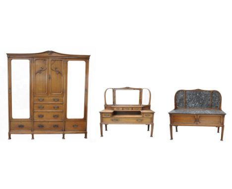 A good three piece Art Nouveau oak bedroom suite, circa 1890
The fine compactum wardrobe with a shaped pediment above a pair 