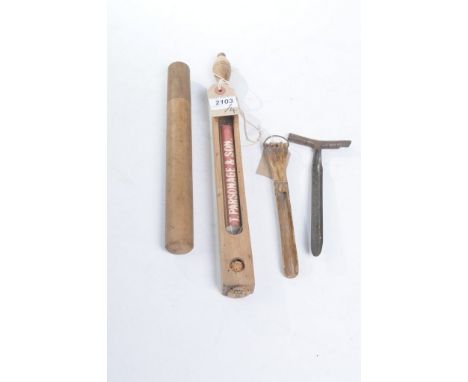 A vintage pine cased dairy thermometer
Of shaped rectangular form with a baluster handle enclosing a thermometer stamped T Pa