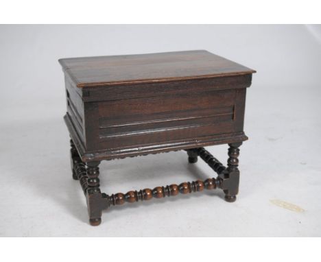 A rare 17th Century oak close stool
The rectangular moulded top with a plain frieze above a moulded lip, enclosing a pine she