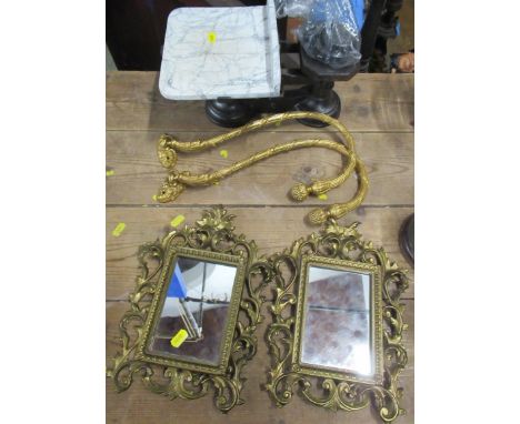 A pair of mirrors, in gilt metal scroll frames with easel back, overall 11ins x 9ins, together with a pair of gilt metal curt