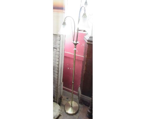 A standard lamp, with three glass shades