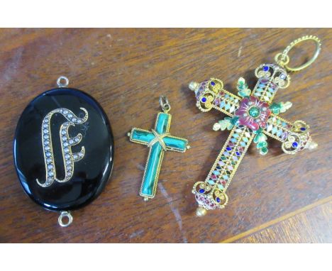 A Victorian locket, with seed pearl decoration, together with an agate set cross and a gilt metal and enamel cross