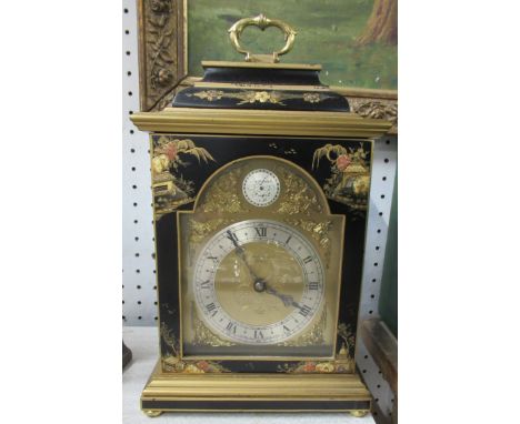 A mantel clock, with faux Oriental lacquer case with Eastern design