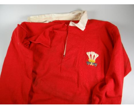 A 1953-1957 WALES RUGBY UNION MATCH WORN JERSEY NUMBER 4, ISSUED TO GARETH GRIFFITHS with white collar, long sleeves, embroid