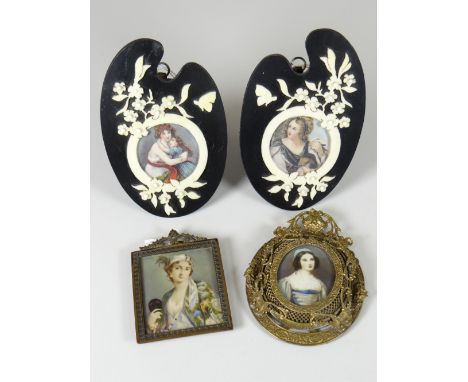 GROUP OF ASSORTED PORTRAIT MINIATURES to include hand painted oval depiction of a nurse in pierced easel frame, pair of flora