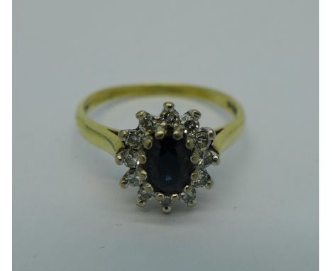 An 18ct gold cluster ring, 2.8g, L