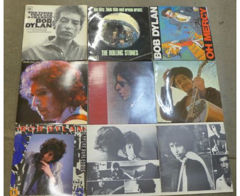 Seven Bob Dylan LP records and one Rolling Stones LP record