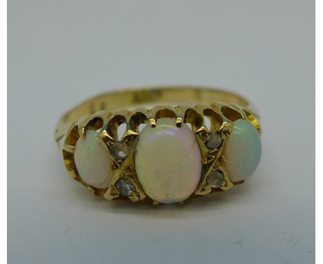 An 18ct gold, opal and diamond ring, 3.3g, P