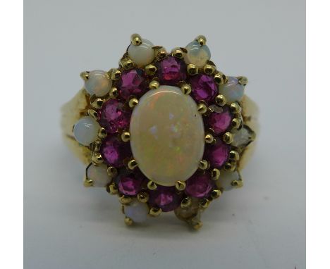 A 9ct gold, opal and ruby cluster ring, lacking one opal, 4.3g, M