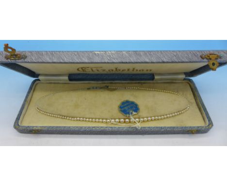 A simulated pearl necklace, boxed