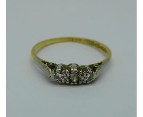 An 18ct gold and platinum set three stone ring, 2.3g, S