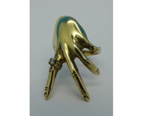 A 9ct gold 'hand' ring, 5.4g, O