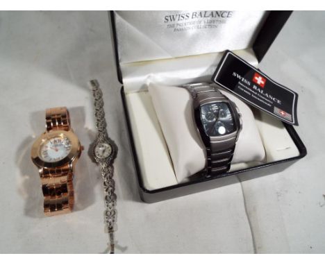 A lady's silver wristwatch set with marquisette throughout and a mother of pearl fascia, boxed, a Jeremie Sion Joaillerie des